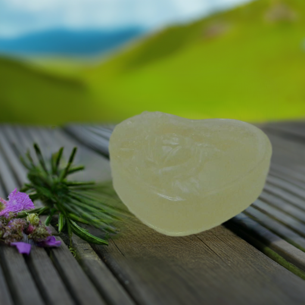 a piece of soap sitting on top of a wooden table