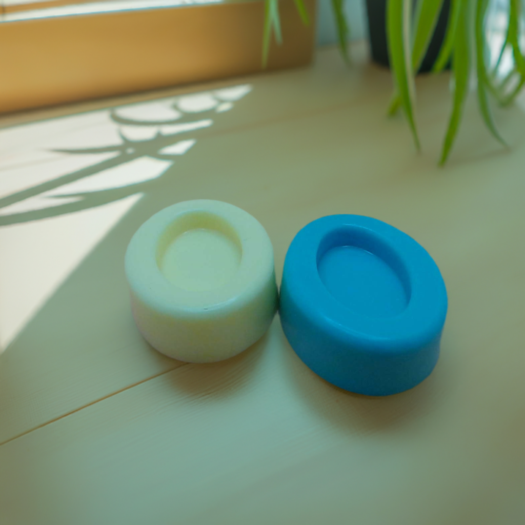 a blue and a white soap sitting on a table