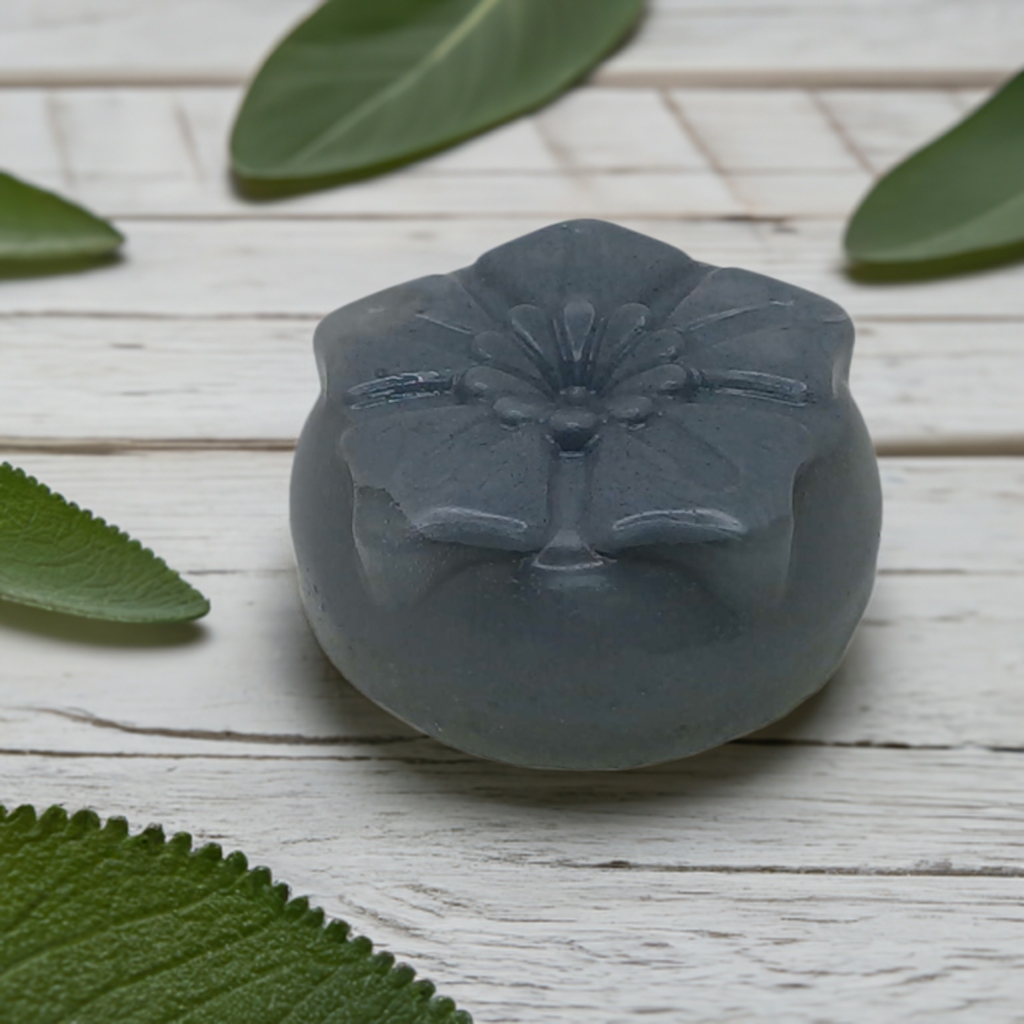 a waxed object sitting on top of a wooden table