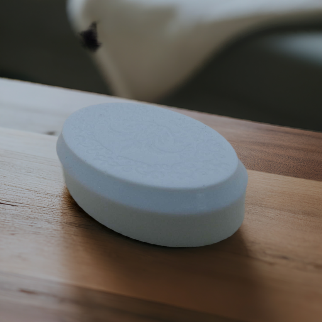 a white object sitting on top of a wooden table