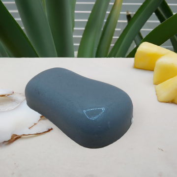 a soap of fruit sitting on top of a table