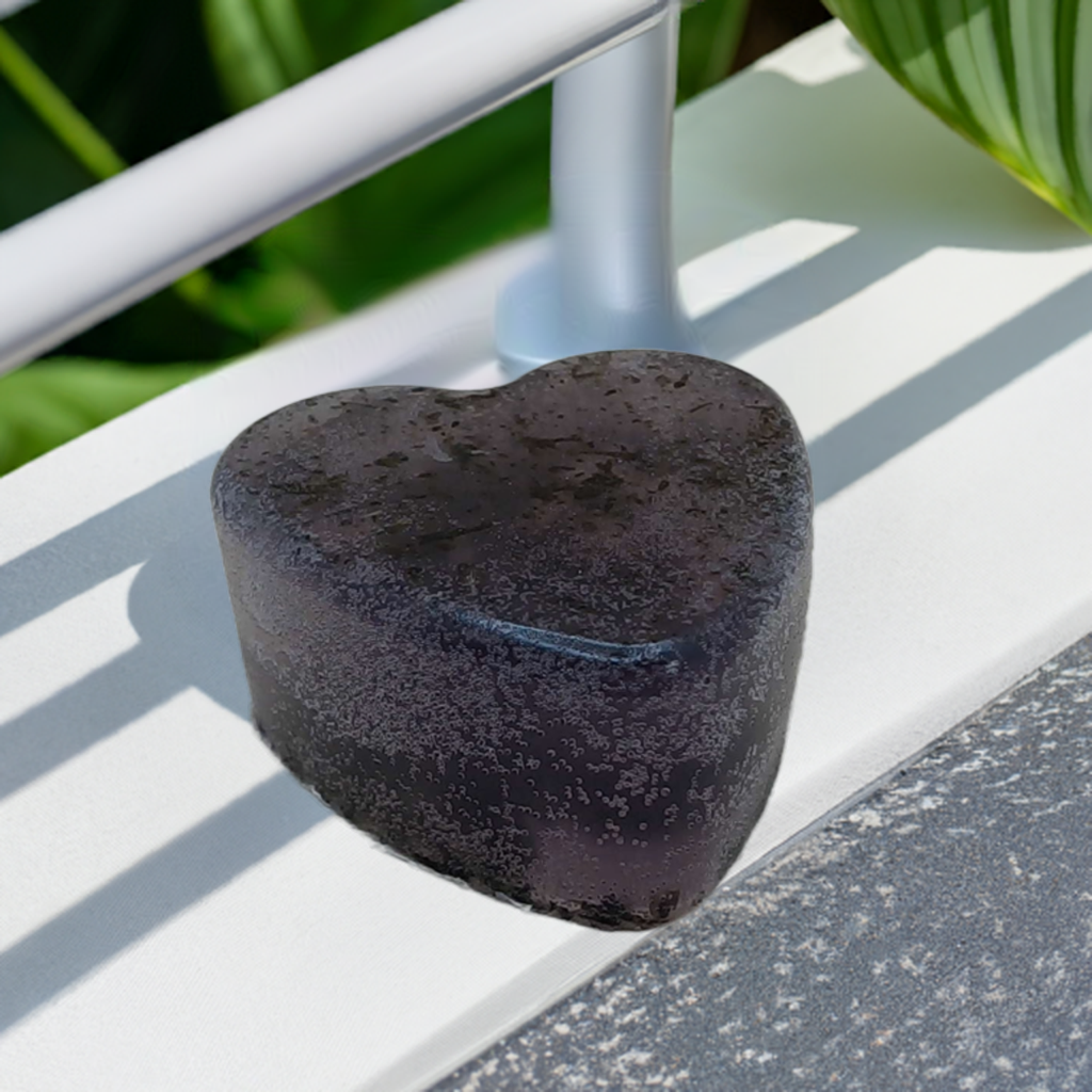 a heart shaped soap sitting on top of a white bench