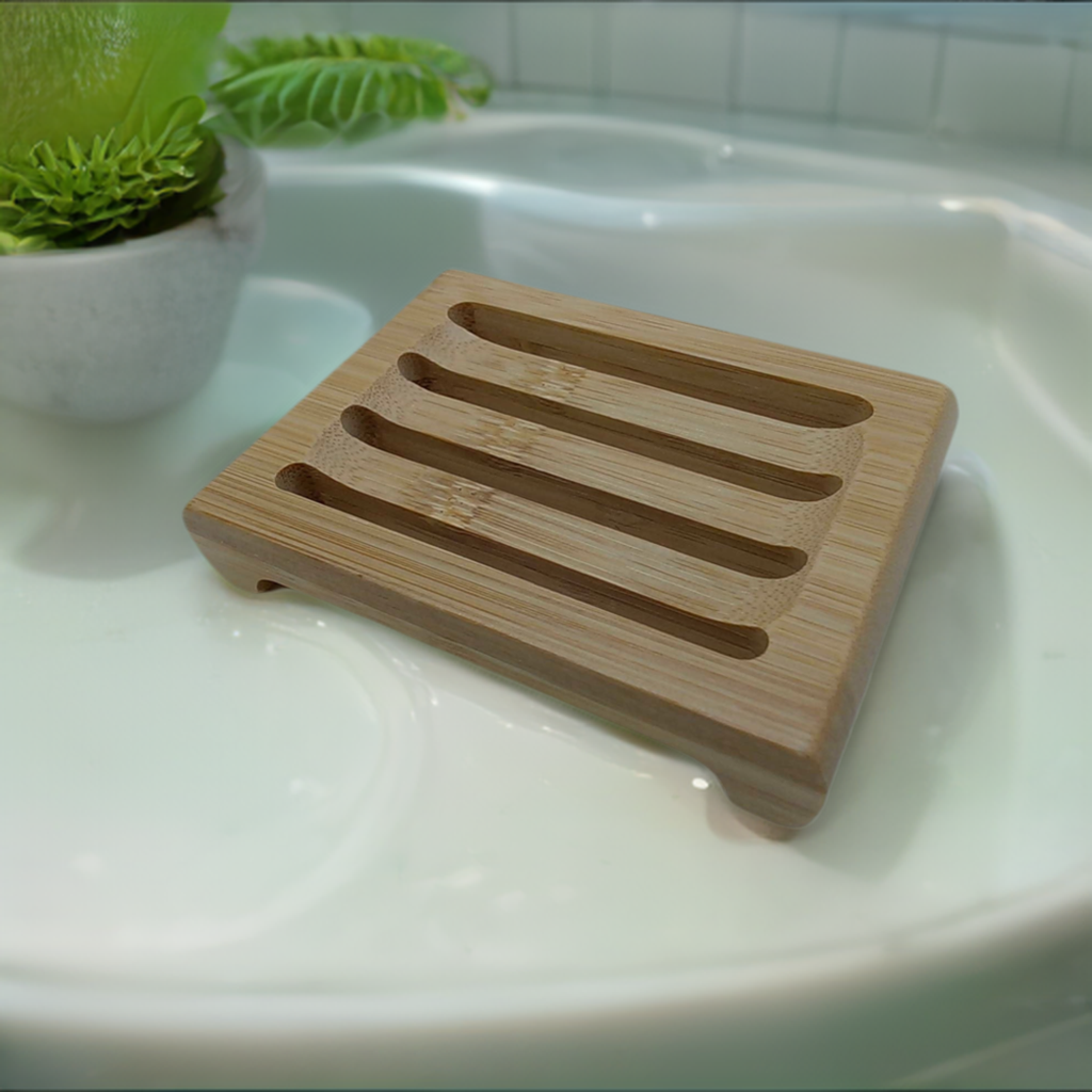 a wooden soap dish sitting on top of a white sink