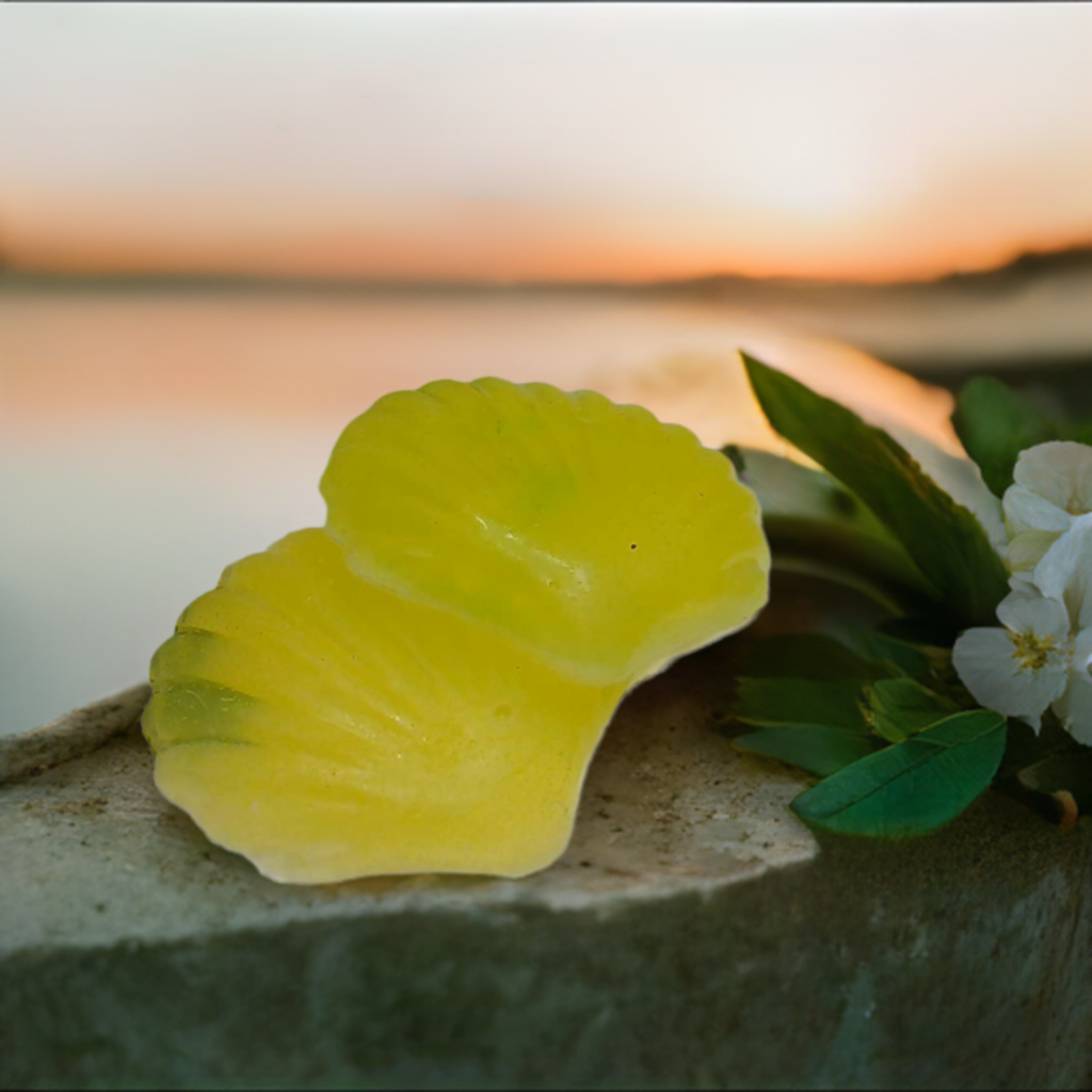 a yellow flower sitting on top of a cement block