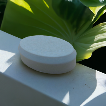 a white soap sitting on top of a white table