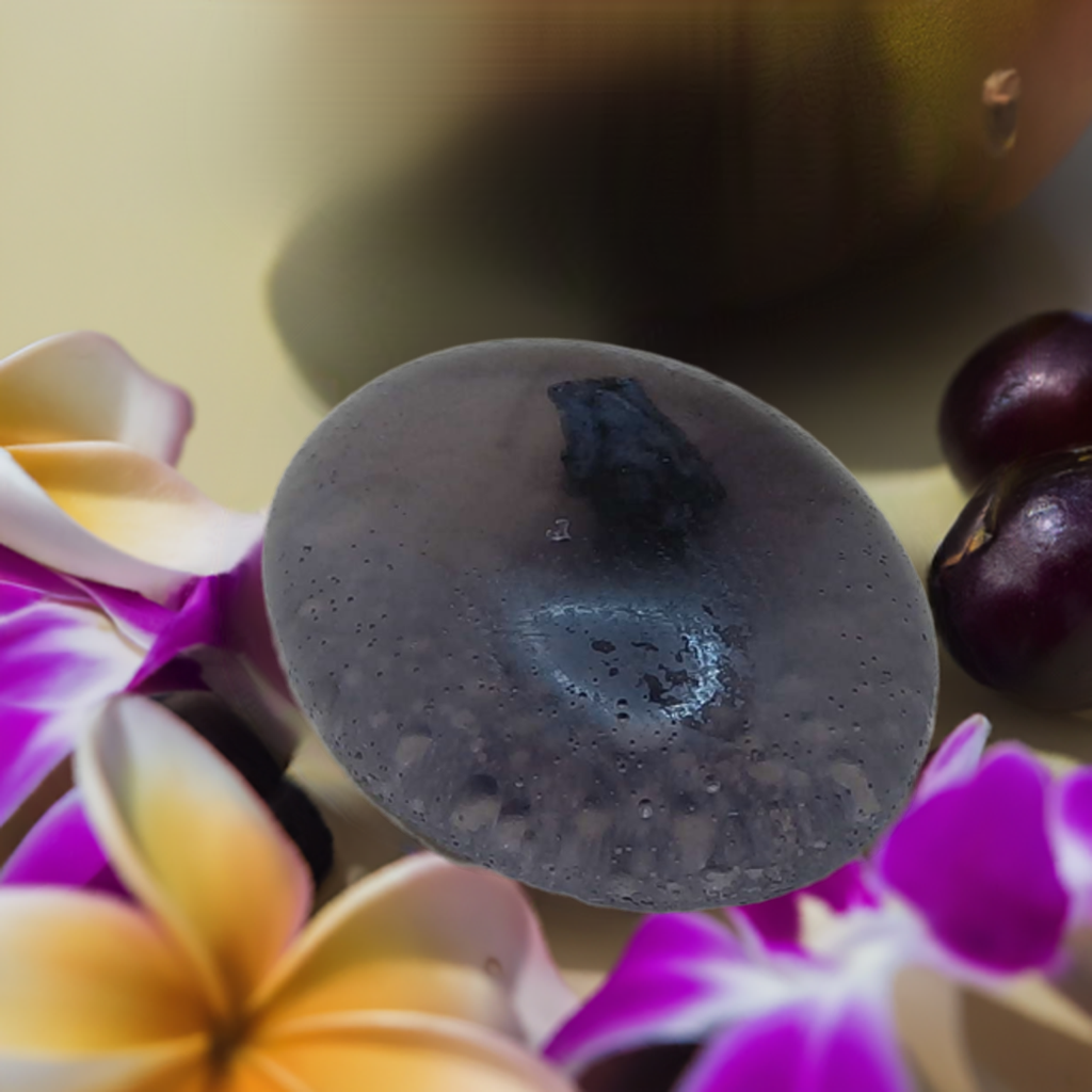 a close up of a soap dish surrounded by flowers