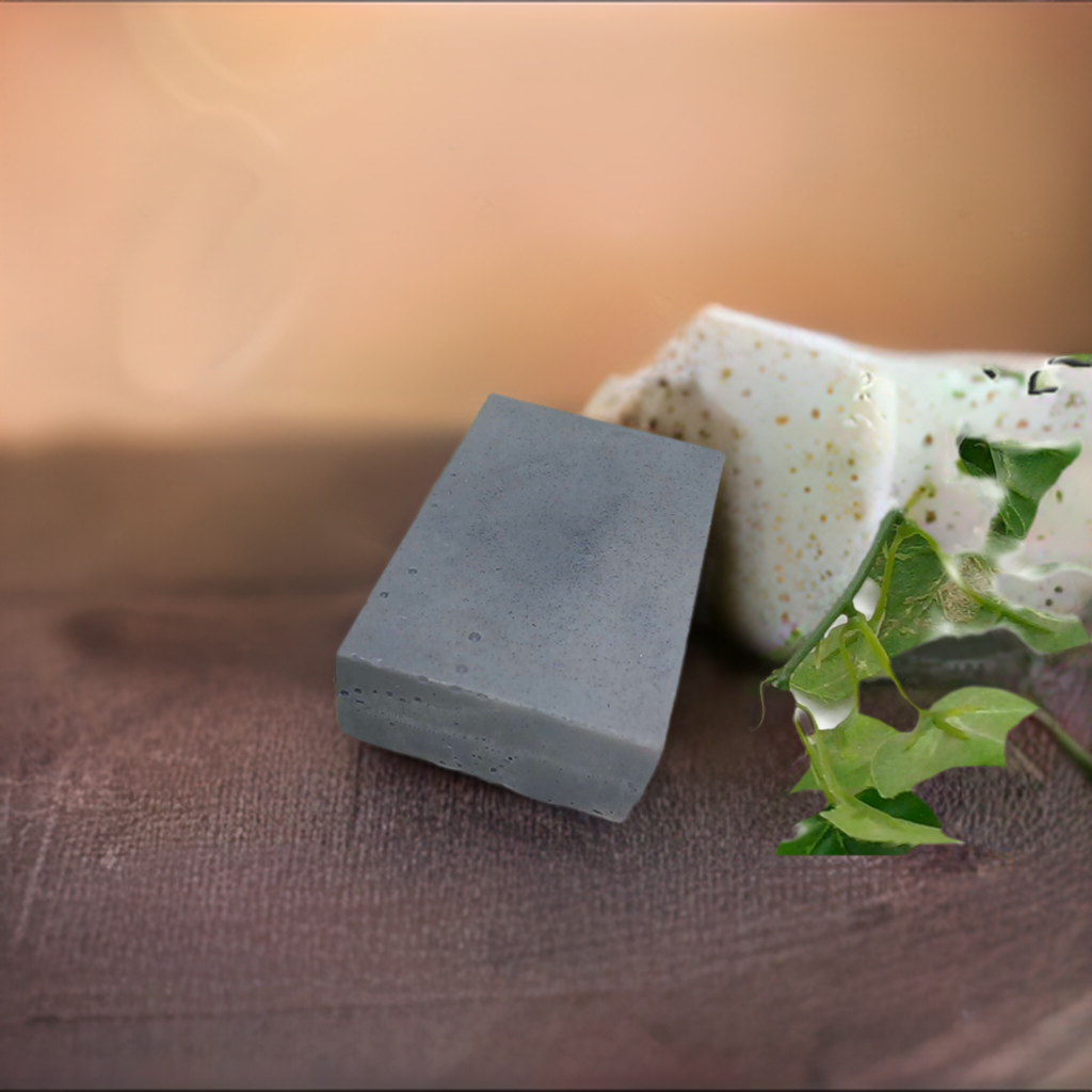 a bar of soap next to a plant on a table