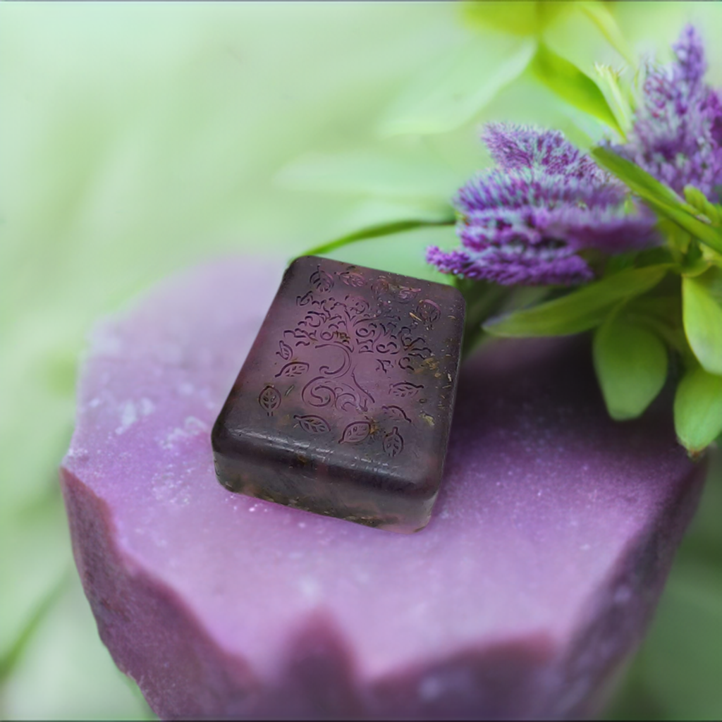 a purple object sitting on top of a purple block