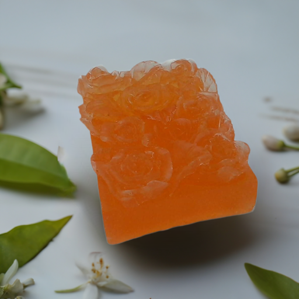 a piece of orange gummy sitting on top of a table